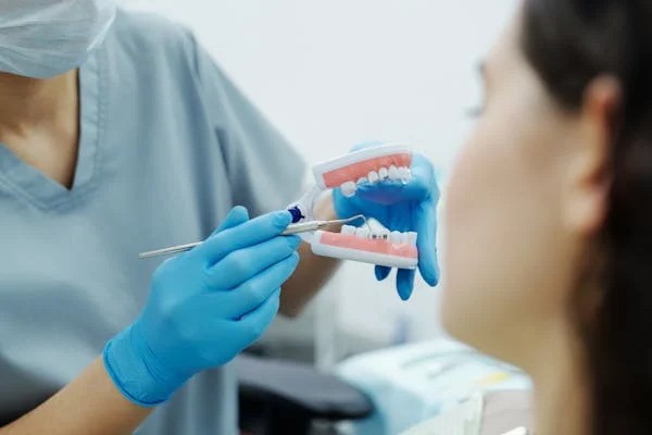 a woman getting braces at a dental clinic
